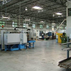 Sherline's Mazak robotic loader can pick up raw parts, place them in the chuck and return the finished part to the table. Once an operator sets up the machine and the raw materials are placed on the special table, the machine will finish all the parts by itself. 