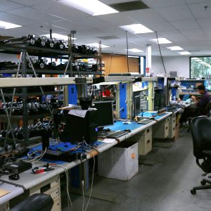 CNC machines being assembled and tested.